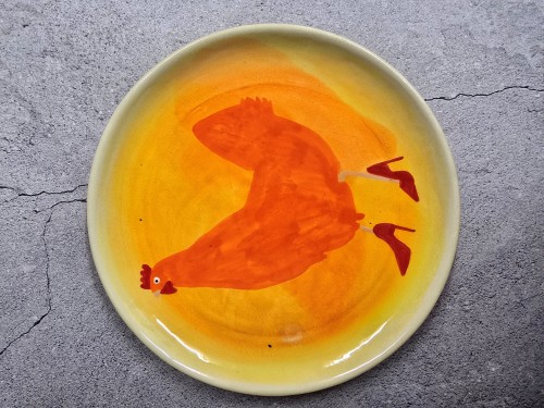 Apelsininė višta raudonais batukais